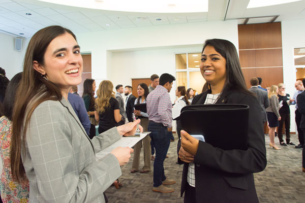 bachelor's in global business interns at a professional event
