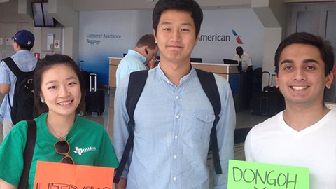 three jindal school global business students picking up exchange students at the airport