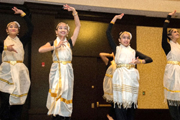 students dancing at an International Management Studies cultural experience