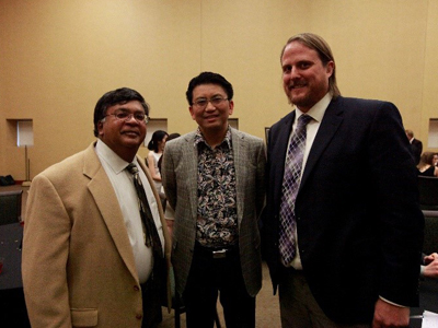 Dean Varghese and OSIM faculty leader, Dr. Mike Peng and MS IMS student Graham Impey.