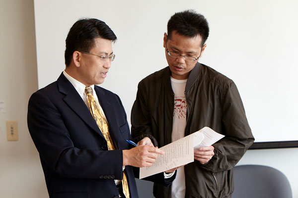 Dr. Mike Peng with a student