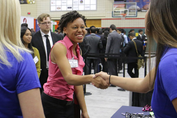 an Organizations, Strategy and International Management student talks with recruiters at the Fall 2017 Career Expo.