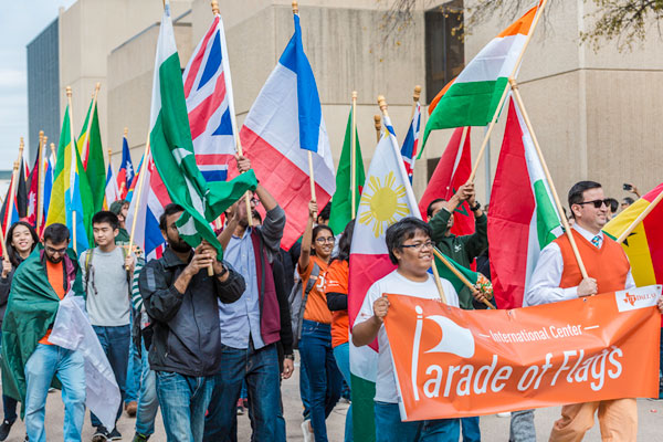 ut dallas students in an international flag parade