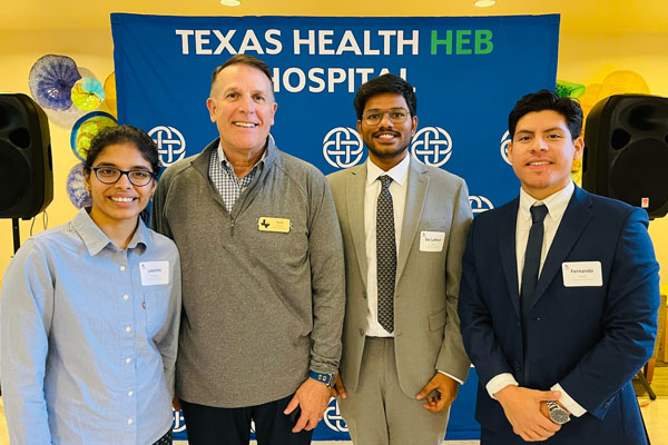 Texas Health Resources and ACHE of North Texas Case Competition October 3, 2023. Second place winners from left Lakshmi Rayapati, Director Keith Thurgood, Sai Lakhan Kyasa and Fernando Fuerte.